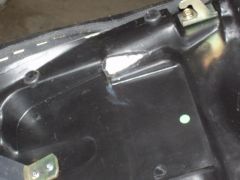 Seat modification to eliminate battery interference