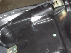 Seat modification to eliminate battery interference